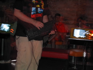 Nullsleep of Wily Weeps, with his PC keyboard Game Boy controller.  Remote Lounge 2003 08 02, image 20 of 49.